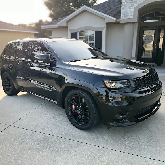 Black Jeep Grand Cherokee SRT — ceramic tint, Palm Coast driveway