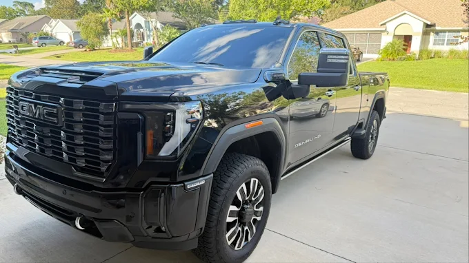 Black GMC Sierra Denali 2500 HD — deep ceramic tint