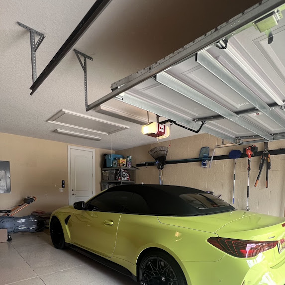 Lime BMW M4 Competition — ceramic tint installed in customer's garage