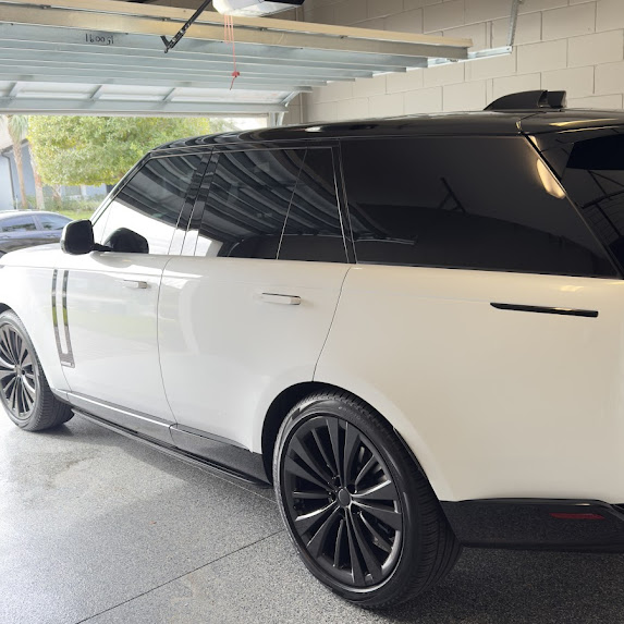 White Range Rover — deep black ceramic tint, clean garage finish